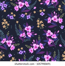 Seamless floral pattern with exotic flowers. Pink lilies flowers on a dark blue background. Branches and points with small flowers are scattered on the surface. A bouquet flowers for fashion prints.