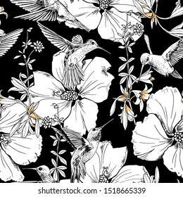 Seamless floral pattern. Exotic Tropical Hibiscus flowers and hummingbirds on a black background. Textile composition, hand drawn style print. Vector illustration.