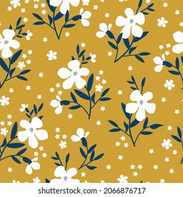 Seamless floral pattern. Fashionable background of white flowers, blue leaves. flowers scattered on a mustard background. Stock vector for printing on surfaces and web design.