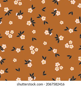 Seamless floral pattern. Fashionable background of white flowers and black leaves. flowers scattered on a terracotta background. Stock vector for printing on surfaces and web design.
