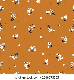 Seamless floral pattern. Fashionable background of white flowers and dark blue leaves. flowers scattered on a terracotta background. Stock vector for printing on surfaces and web design.