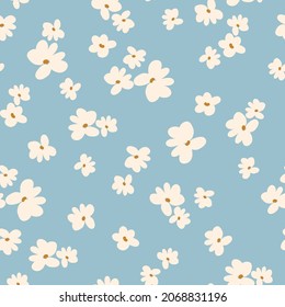 Seamless floral pattern. Fashionable background of wonderful white flowers . flowers scattered on a light blue background. Stock vector for printing on surfaces and web design.
