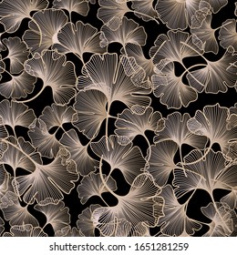 Seamless floral pattern with graphic gold  ginkgo leaves. Ginkgo leaves on black background