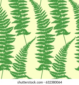 Seamless floral pattern. Green leaves of a fern on a beige background. vector illustration.