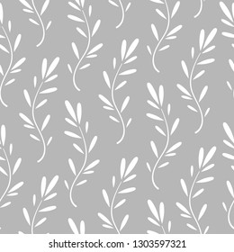 Seamless floral pattern with little white blades of grass. Floral texture on grey background. Cartoon style sprigs with oval leaflets. For printing on fabric or paper. Vector illustration.