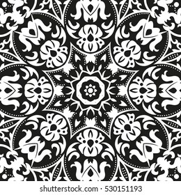 Seamless floral pattern motif coloring mandala drawn with a pen. black and white. Ethnic, fabric, motifs. Vector, abstract flower mandala. Decorative elements for design. EPS 10.