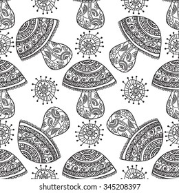 
Seamless floral pattern mushrooms grow. Mushrooms and whimsical flowers, black and white graphics, painted by hand. For the design and decoration background, wallpaper, packaging, fabrics, textiles.