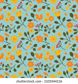 Seamless floral pattern in orange, yellow, blue and green colours. Repetitive background with different flowers, leaves and branches. Backdrop with plants drawn in a simple and modern style. 