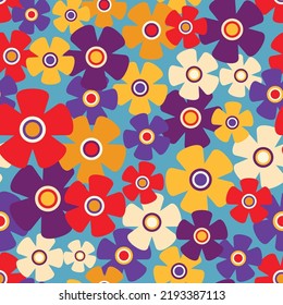 Seamless floral pattern, retro style ditsy print with small decorative flowers. Colorful botanical background design with little flower head on blue surface. Vector illustration.