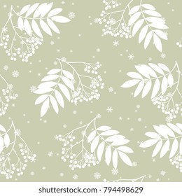 Seamless floral pattern with silhouettes of rowan tree clusters and snowflakes.