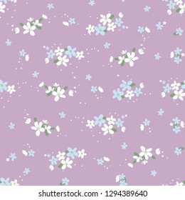 Seamless floral pattern with small cute flowers on a light violet background. light floral texture.