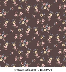 Seamless floral pattern with small flowers on a dark background
