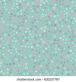 Seamless floral pattern with small summer colored flowers. Vector repeating texture.