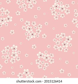 Seamless floral pattern of small white flowers. Small flowers scattered on a light pink background. Stock vector for printing on surfaces and web design.
