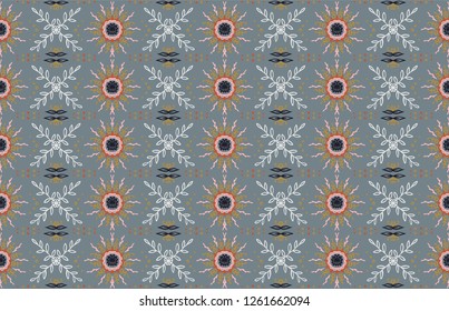 Seamless floral pattern. Stylized doodle flowers. Spanish ethnic embroidery. Folk ornament. Solar sign. Mediterranean print. Indian Oriental or Turkish textiles.  Boho wallpaper. Hipster  art.