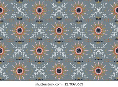 Seamless floral pattern. Stylized doodle flowers. Spanish ethnic embroidery. Folk ornament. Solar sign. Mediterranean print. Indian Oriental or Turkish textiles.  Boho wallpaper. Hipster  art.