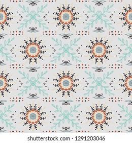 Seamless floral pattern. Stylized doodle flowers. Spanish ethnic embroidery. Folk ornament. Solar sign. Mediterranean print. Indian Oriental or Turkish textiles.  Boho wallpaper. Hipster  art.