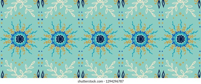 Seamless floral pattern. Stylized doodle flowers. Spanish ethnic embroidery. Folk ornament. Solar sign. Mediterranean print. Indian Oriental or Turkish textiles.  Boho wallpaper. Hipster  art.