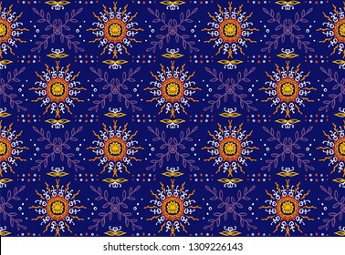 Seamless floral pattern. Stylized doodle flowers. Spanish ethnic embroidery. Folk ornament. Solar sign. Mediterranean print. Indian Oriental or Turkish textiles.  Boho wallpaper. Hipster  art.