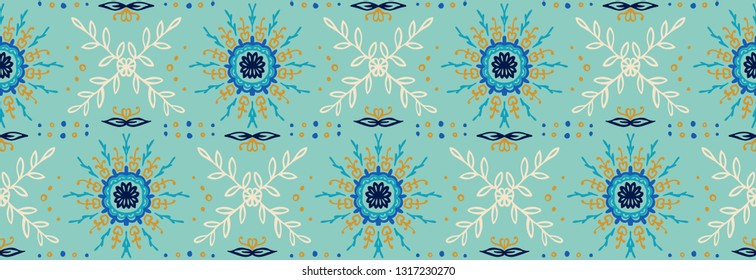 Seamless floral pattern. Stylized doodle flowers. Spanish ethnic embroidery. Folk ornament. Solar sign. Mediterranean print. Indian Oriental or Turkish textiles.  Boho wallpaper. Hipster  art.