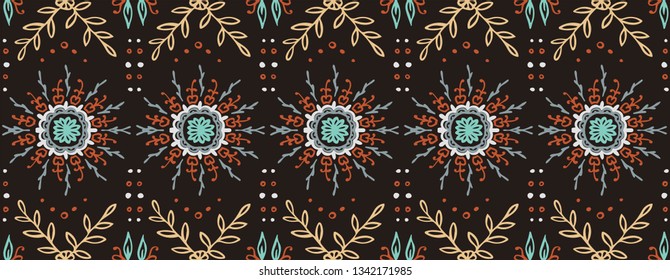 Seamless floral pattern. Stylized doodle flowers. Spanish ethnic embroidery. Folk ornament. Solar sign. Mediterranean print. Indian Oriental or Turkish textiles.  Boho wallpaper. Hipster  art.