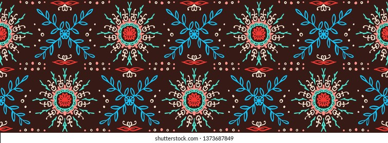 Seamless floral pattern. Stylized doodle flowers. Spanish ethnic embroidery. Folk ornament. Solar sign. Mediterranean print. Indian Oriental or Turkish textiles.  Boho wallpaper. Hipster  art.