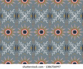 Seamless floral pattern. Stylized doodle flowers. Spanish ethnic embroidery. Folk ornament. Solar sign. Mediterranean print. Indian Oriental or Turkish textiles.  Boho wallpaper. Hipster  art.