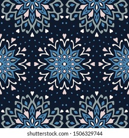 Seamless floral pattern. Stylized doodle flowers. Spanish ethnic embroidery. Folk ornament. Solar sign. Mediterranean print. Indian Oriental or Turkish textiles. Boho wallpaper. Hipster art.