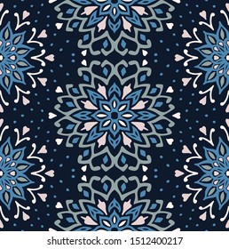 Seamless floral pattern. Stylized doodle flowers. Spanish ethnic embroidery. Folk ornament. Solar sign. Mediterranean print. Indian Oriental or Turkish textiles. Boho wallpaper. Hipster art.