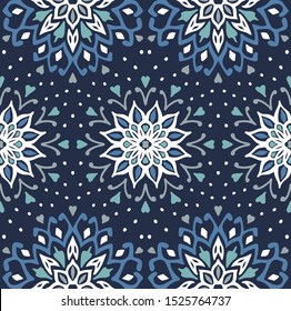 Seamless floral pattern. Stylized doodle flowers. Spanish ethnic embroidery. Folk ornament. Solar sign. Mediterranean print. Indian Oriental or Turkish textiles. Boho wallpaper. Hipster art.