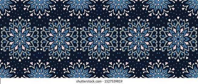 Seamless floral pattern. Stylized doodle flowers. Spanish ethnic embroidery. Folk ornament. Solar sign. Mediterranean print. Indian Oriental or Turkish textiles. Boho wallpaper. Hipster art.