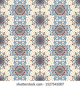 Seamless floral pattern. Stylized doodle flowers. Spanish ethnic embroidery. Folk ornament. Solar sign. Mediterranean print. Indian Oriental or Turkish textiles. Boho wallpaper. Hipster art.