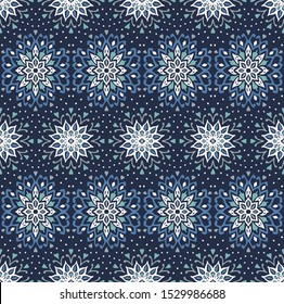 Seamless floral pattern. Stylized doodle flowers. Spanish ethnic embroidery. Folk ornament. Solar sign. Mediterranean print. Indian Oriental or Turkish textiles. Boho wallpaper. Hipster art.