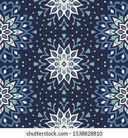 Seamless floral pattern. Stylized doodle flowers. Spanish ethnic embroidery. Folk ornament. Solar sign. Mediterranean print. Indian Oriental or Turkish textiles. Boho wallpaper. Hipster art.