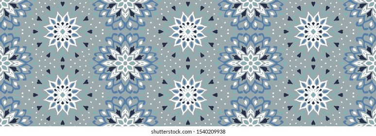 Seamless floral pattern. Stylized doodle flowers. Spanish ethnic embroidery. Folk ornament. Solar sign. Mediterranean print. Indian Oriental or Turkish textiles. Boho wallpaper. Hipster art.
