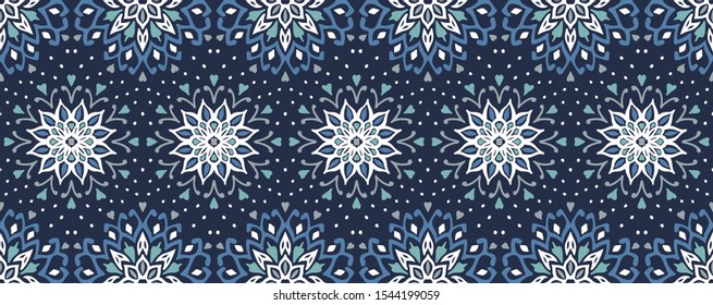 Seamless floral pattern. Stylized doodle flowers. Spanish ethnic embroidery. Folk ornament. Solar sign. Mediterranean print. Indian Oriental or Turkish textiles. Boho wallpaper. Hipster art.