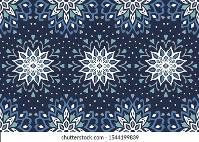 Seamless floral pattern. Stylized doodle flowers. Spanish ethnic embroidery. Folk ornament. Solar sign. Mediterranean print. Indian Oriental or Turkish textiles. Boho wallpaper. Hipster art.