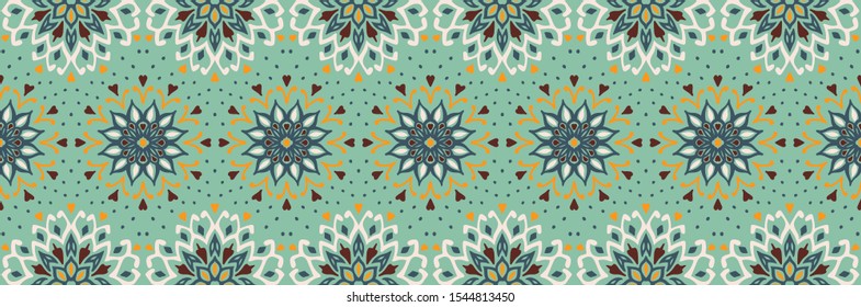Seamless floral pattern. Stylized doodle flowers. Spanish ethnic embroidery. Folk ornament. Solar sign. Mediterranean print. Indian Oriental or Turkish textiles. Boho wallpaper. Hipster art.