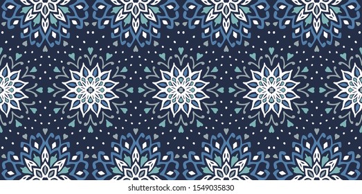 Seamless floral pattern. Stylized doodle flowers. Spanish ethnic embroidery. Folk ornament. Solar sign. Mediterranean print. Indian Oriental or Turkish textiles. Boho wallpaper. Hipster art.