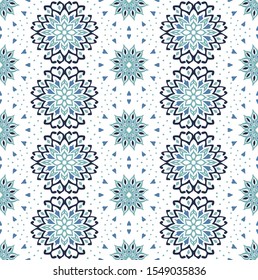 Seamless floral pattern. Stylized doodle flowers. Spanish ethnic embroidery. Folk ornament. Solar sign. Mediterranean print. Indian Oriental or Turkish textiles. Boho wallpaper. Hipster art.