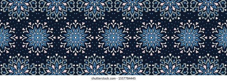 Seamless floral pattern. Stylized doodle flowers. Spanish ethnic embroidery. Folk ornament. Solar sign. Mediterranean print. Indian Oriental or Turkish textiles. Boho wallpaper. Hipster art.