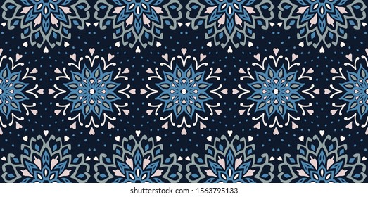 Seamless floral pattern. Stylized doodle flowers. Spanish ethnic embroidery. Folk ornament. Solar sign. Mediterranean print. Indian Oriental or Turkish textiles. Boho wallpaper. Hipster art.
