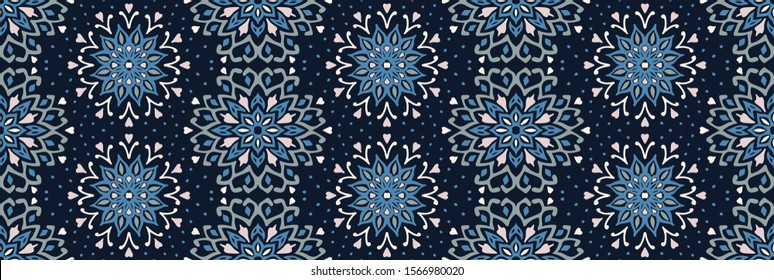 Seamless floral pattern. Stylized doodle flowers. Spanish ethnic embroidery. Folk ornament. Solar sign. Mediterranean print. Indian Oriental or Turkish textiles. Boho wallpaper. Hipster art.