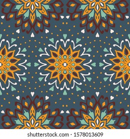 Seamless floral pattern. Stylized doodle flowers. Spanish ethnic embroidery. Folk ornament. Solar sign. Mediterranean print. Indian Oriental or Turkish textiles. Boho wallpaper. Hipster art.