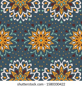 Seamless floral pattern. Stylized doodle flowers. Spanish ethnic embroidery. Folk ornament. Solar sign. Mediterranean print. Indian Oriental or Turkish textiles. Boho wallpaper. Hipster art.