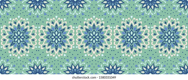 Seamless floral pattern. Stylized doodle flowers. Spanish ethnic embroidery. Folk ornament. Solar sign. Mediterranean print. Indian Oriental or Turkish textiles. Boho wallpaper. Hipster art.