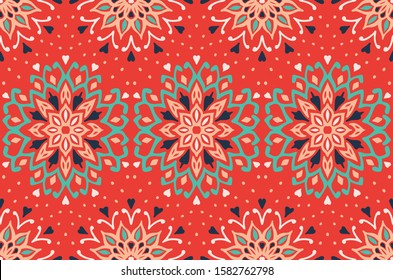 Seamless floral pattern. Stylized doodle flowers. Spanish ethnic embroidery. Folk ornament. Solar sign. Mediterranean print. Indian Oriental or Turkish textiles. Boho wallpaper. Hipster art.