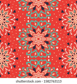 Seamless floral pattern. Stylized doodle flowers. Spanish ethnic embroidery. Folk ornament. Solar sign. Mediterranean print. Indian Oriental or Turkish textiles. Boho wallpaper. Hipster art.