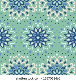 Seamless floral pattern. Stylized doodle flowers. Spanish ethnic embroidery. Folk ornament. Solar sign. Mediterranean print. Indian Oriental or Turkish textiles. Boho wallpaper. Hipster art.
