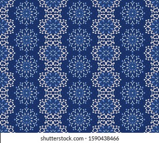 Seamless floral pattern. Stylized doodle flowers. Spanish ethnic embroidery. Folk ornament. Solar sign. Mediterranean print. Indian Oriental or Turkish textiles. Boho wallpaper. Hipster art.